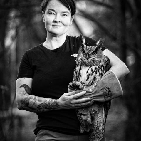 Woman holding an owl