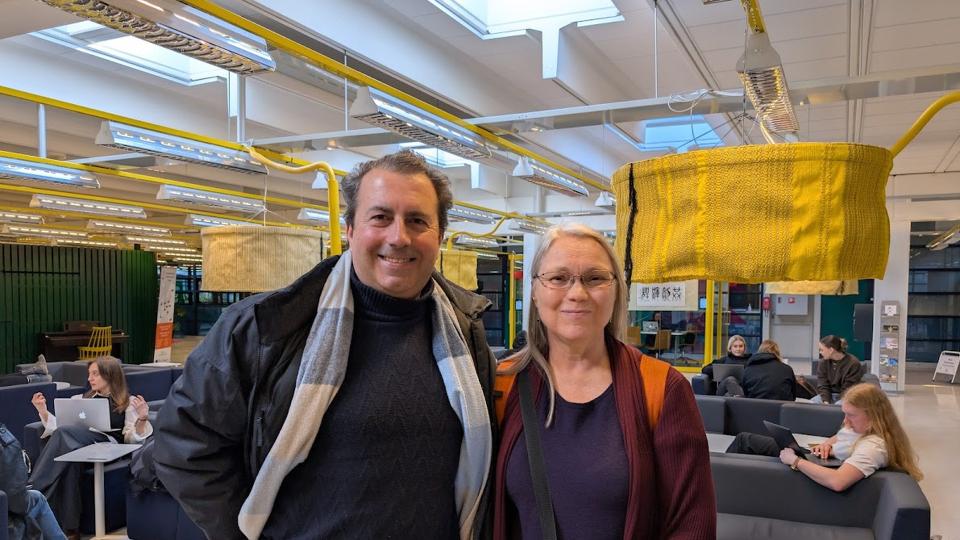 Regis Malet smiling with Elina Lehtomäki at Tellus Backstage space at the University of Oulu