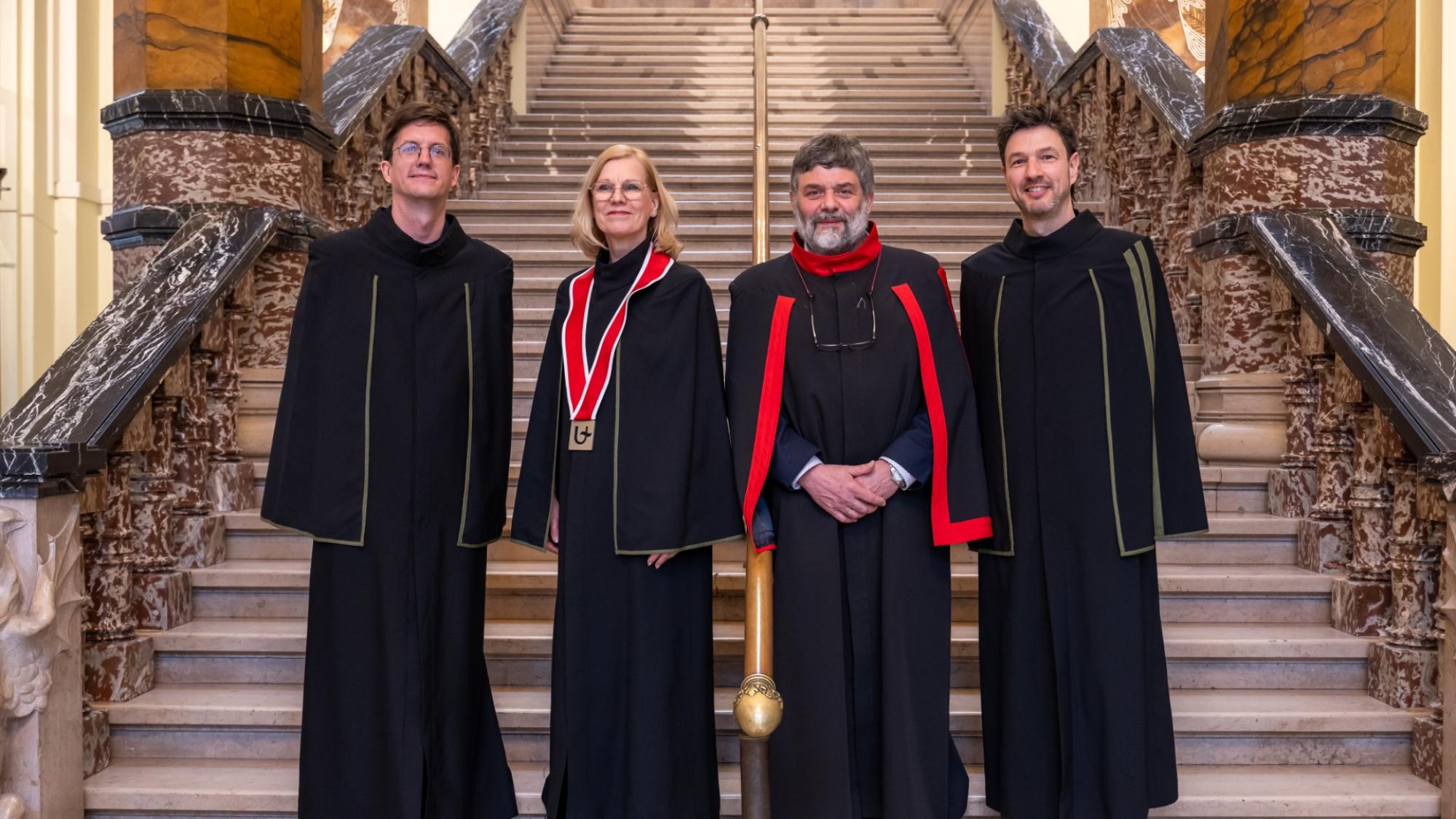 Professors in academic gowns on the stairs of the University of Antwerpen