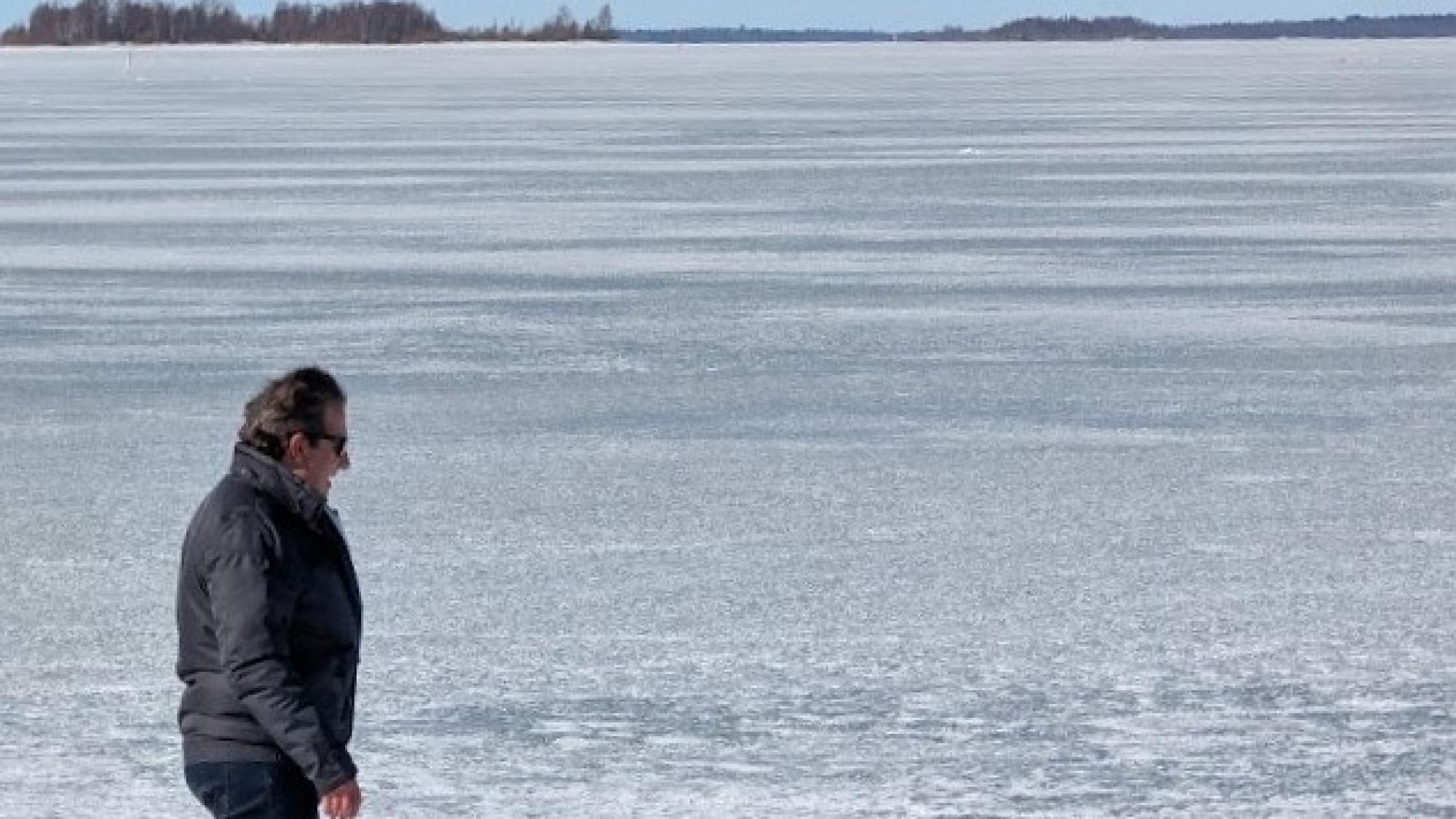 A man on the ice of a lake