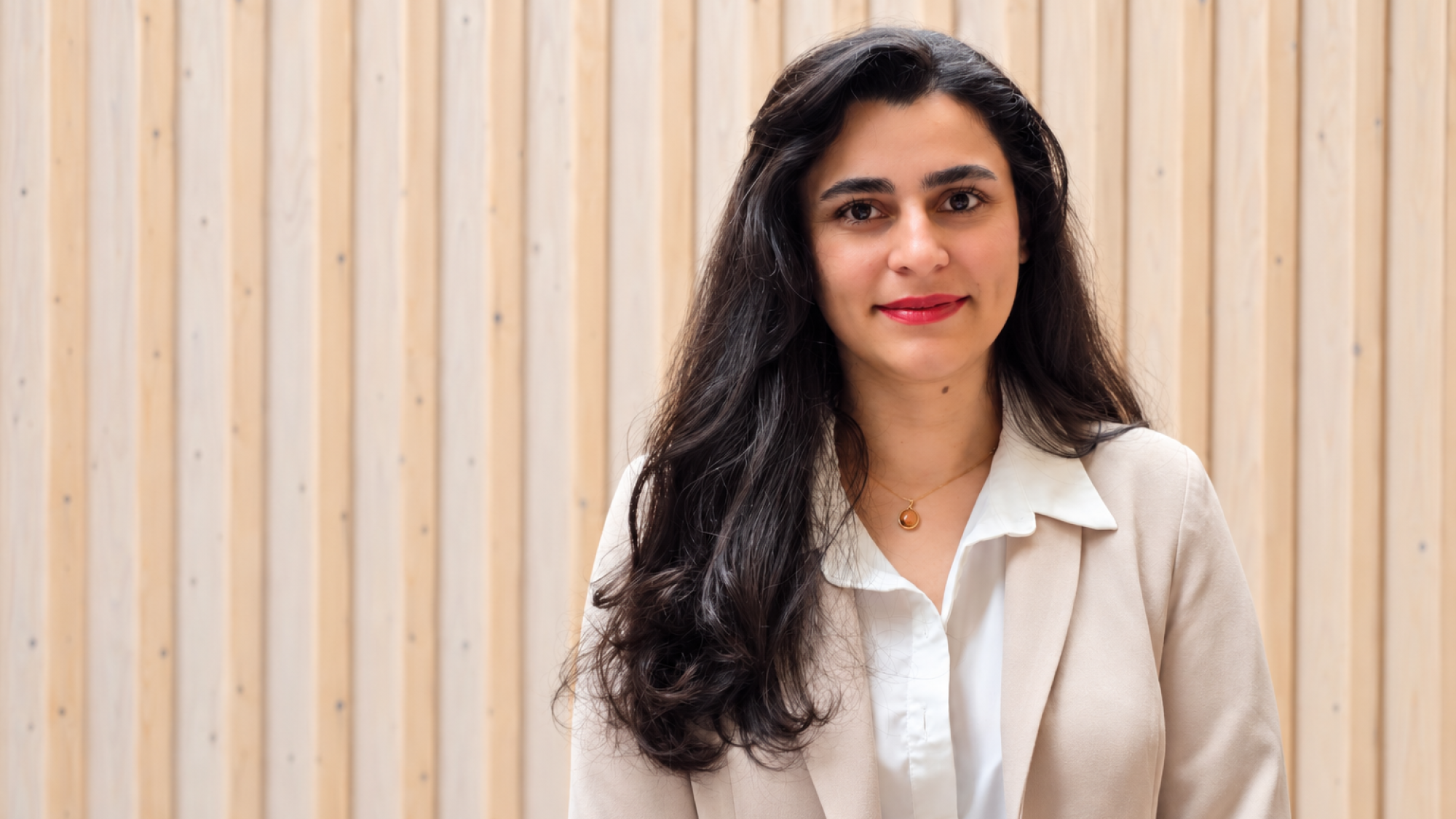 a portrait of Boshra against wooden background  