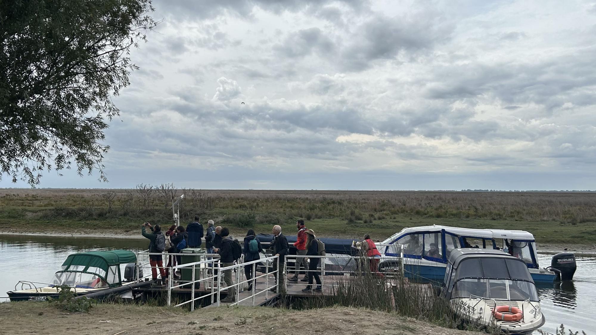 People getting on boats near Black Sea.