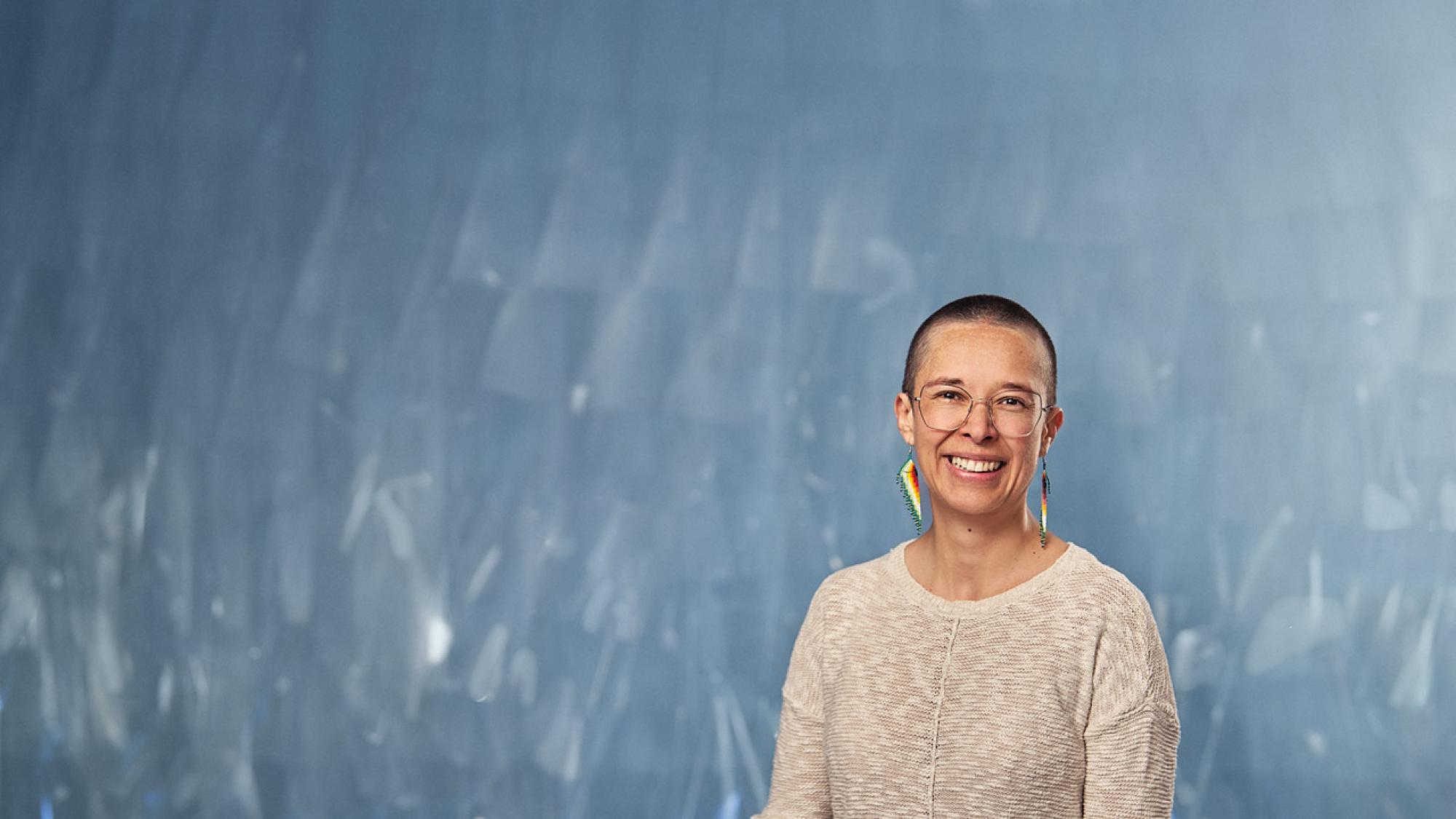 Image of a human smiling to the viewer.