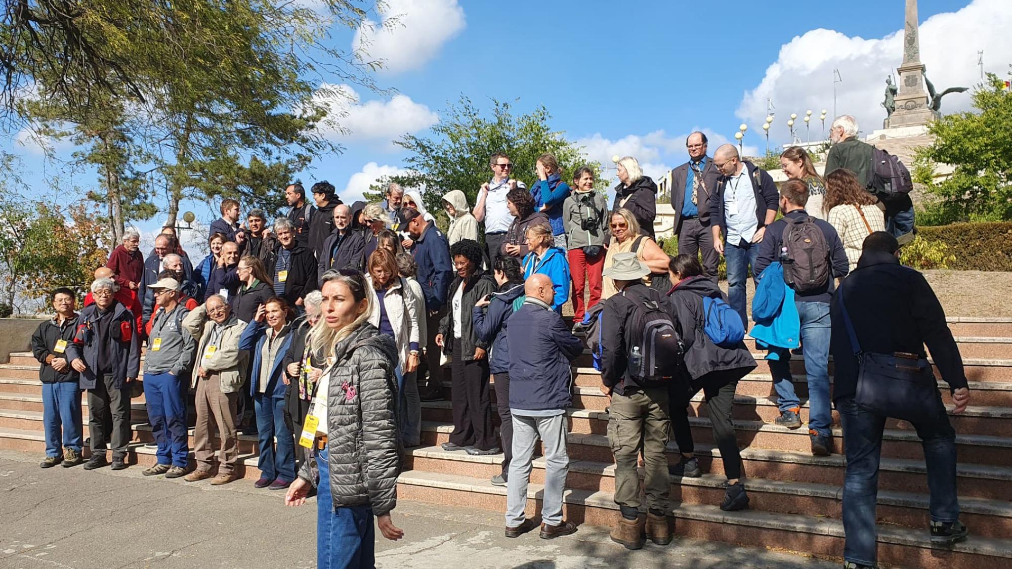 People gathering on big stairs outside