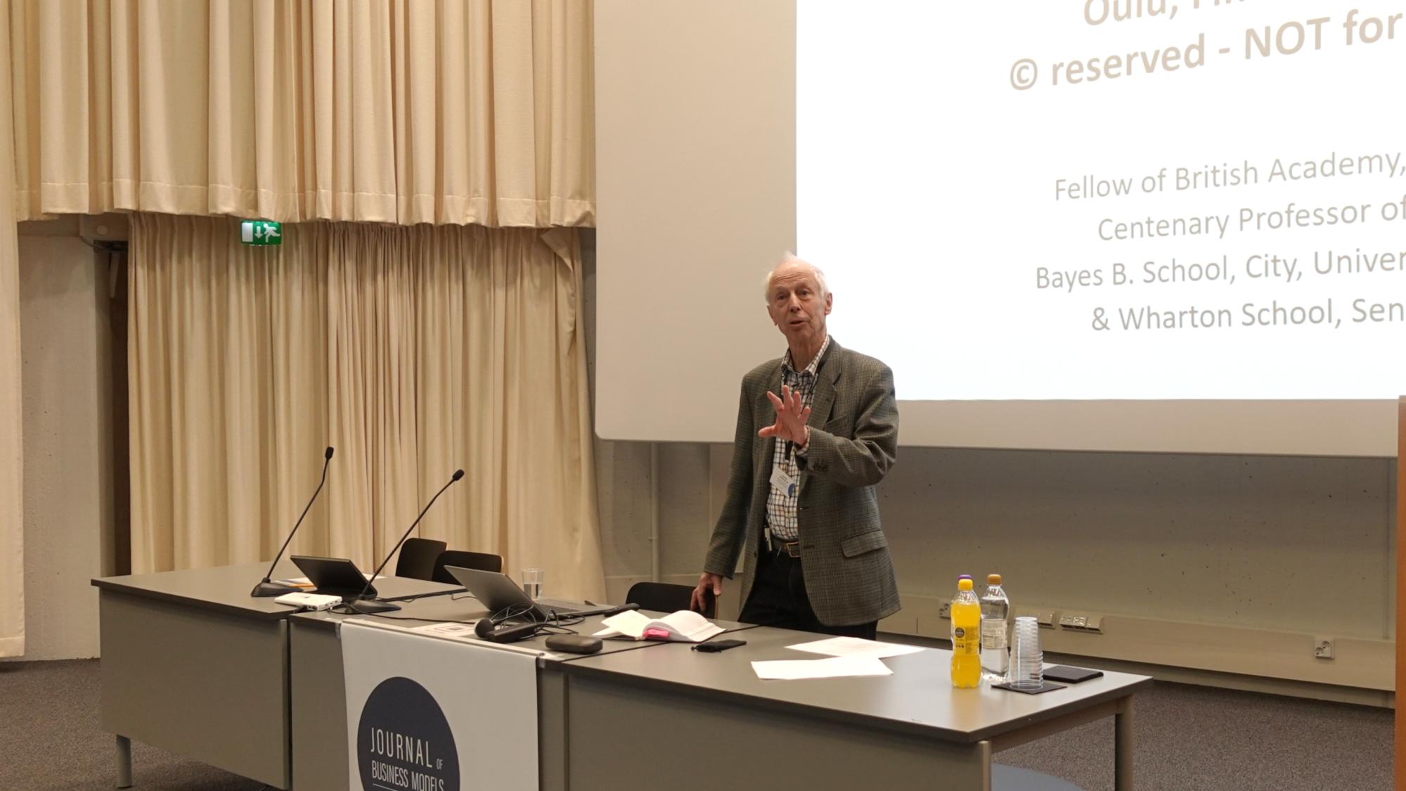 Professor Charles Baden-Fuller giving his keynote presentation at the Business Model Conference 2025.