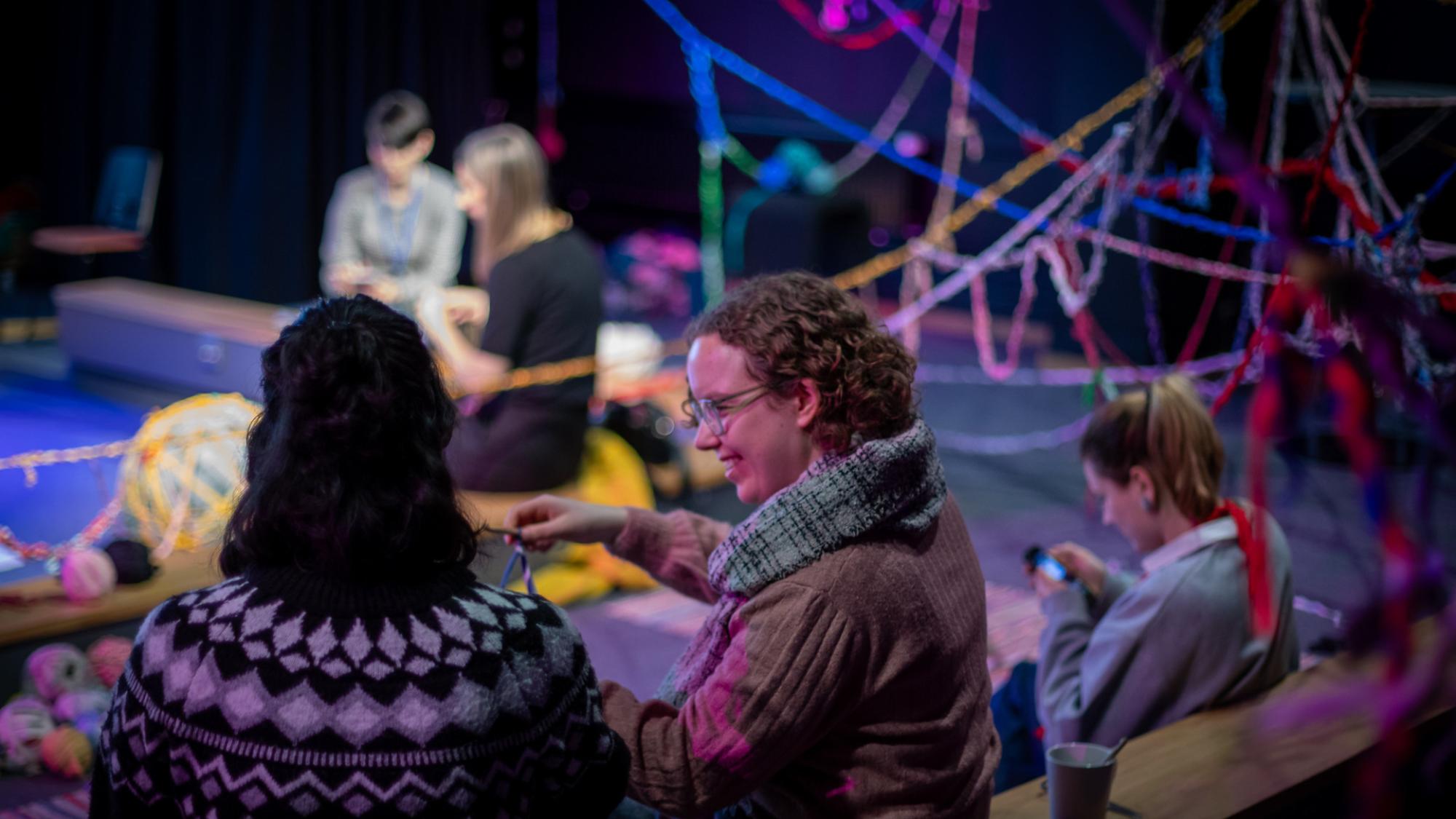 A photo of event participants knitting at Rhizome Salon at ESCA 2026.