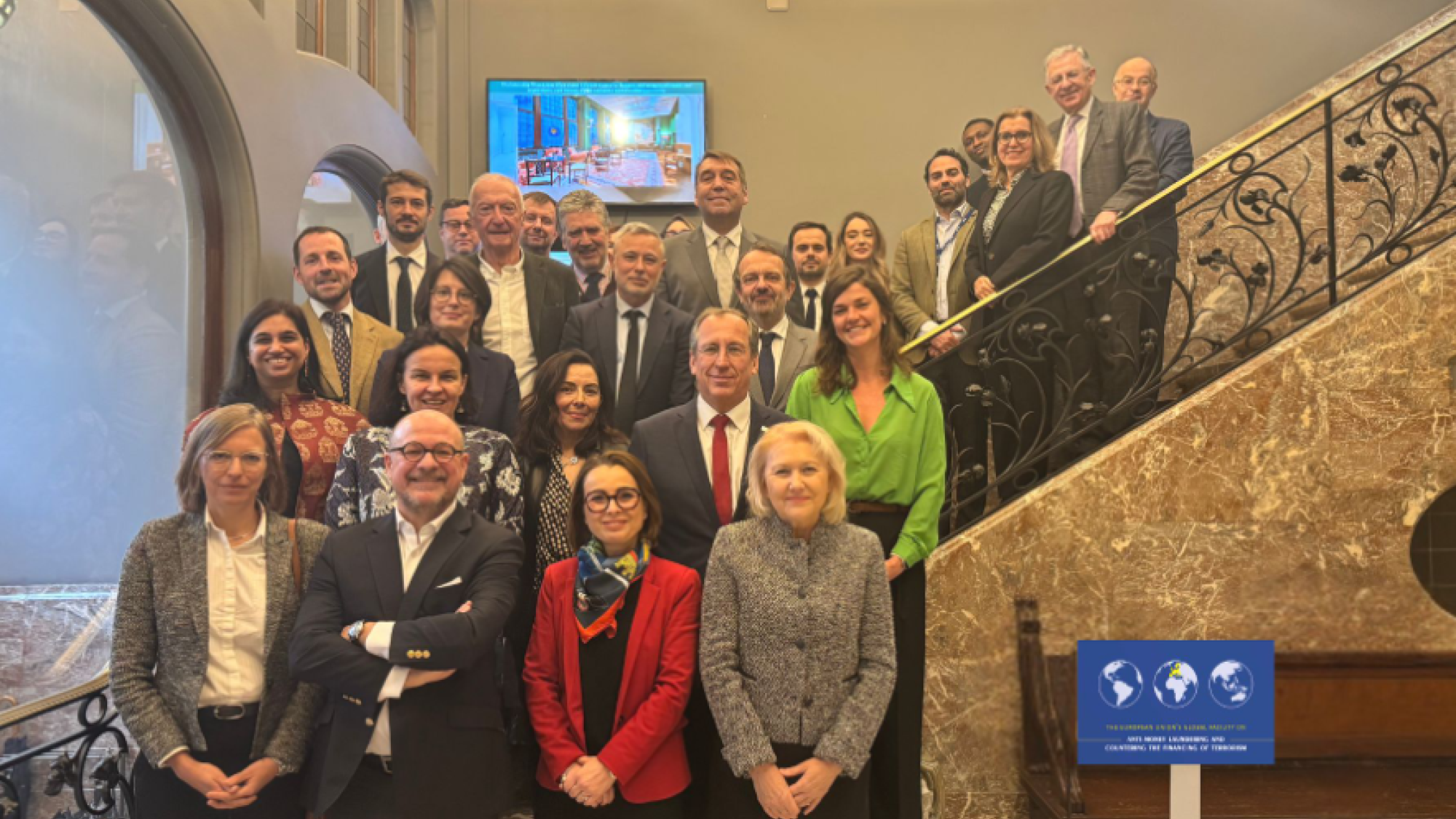 EU AML_CFT Senior Advisory Group members standing on a staircase