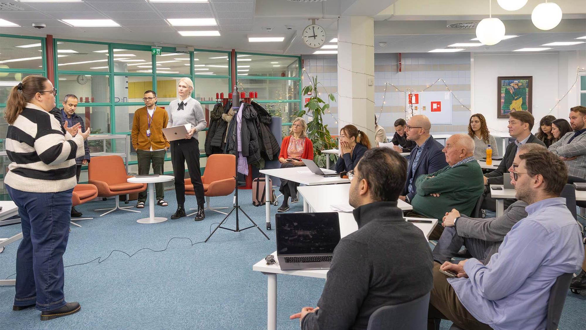 Project member giving  a presentation to the audience