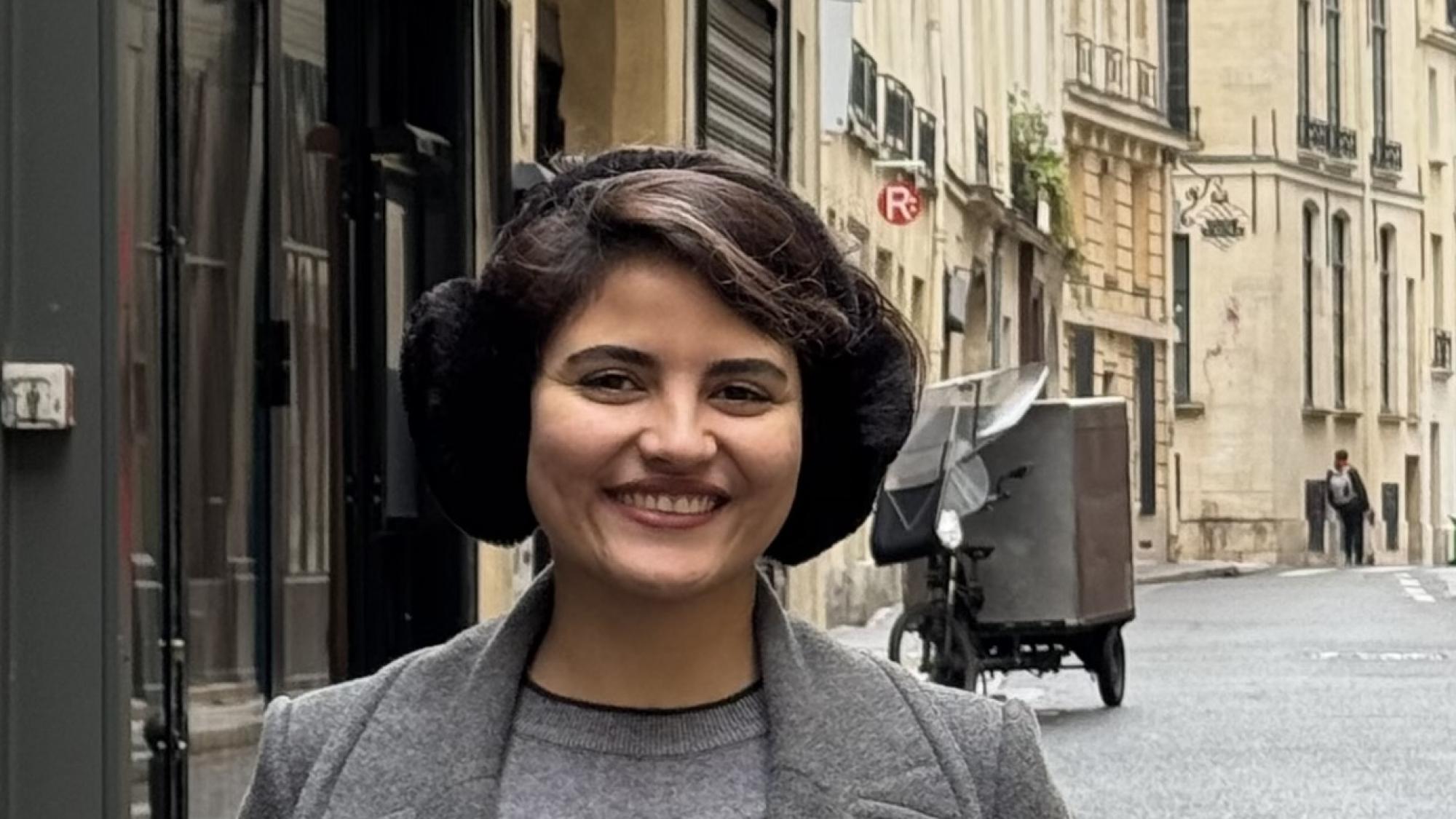 Mansoure Sabour smiling in the street