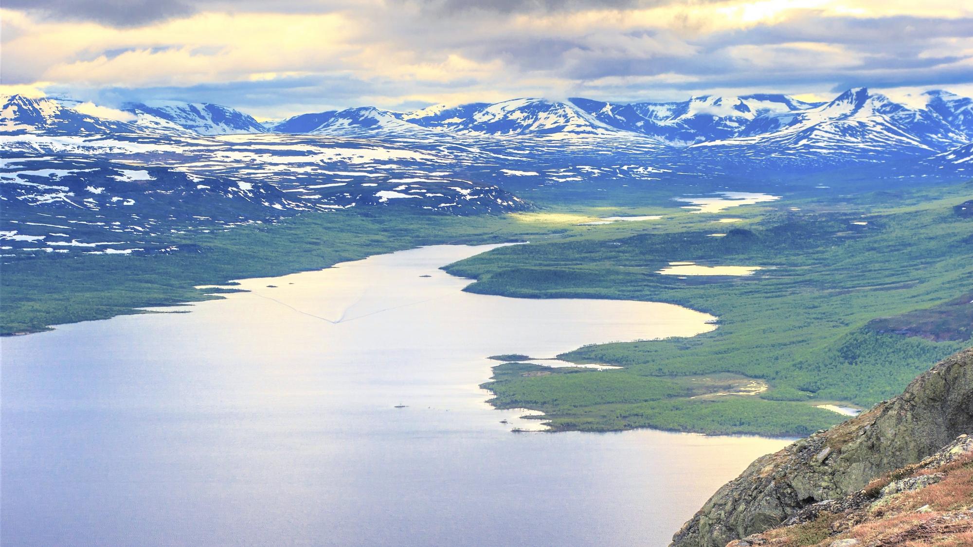 Lake Kilpisjärvi and snowy fells on the background.