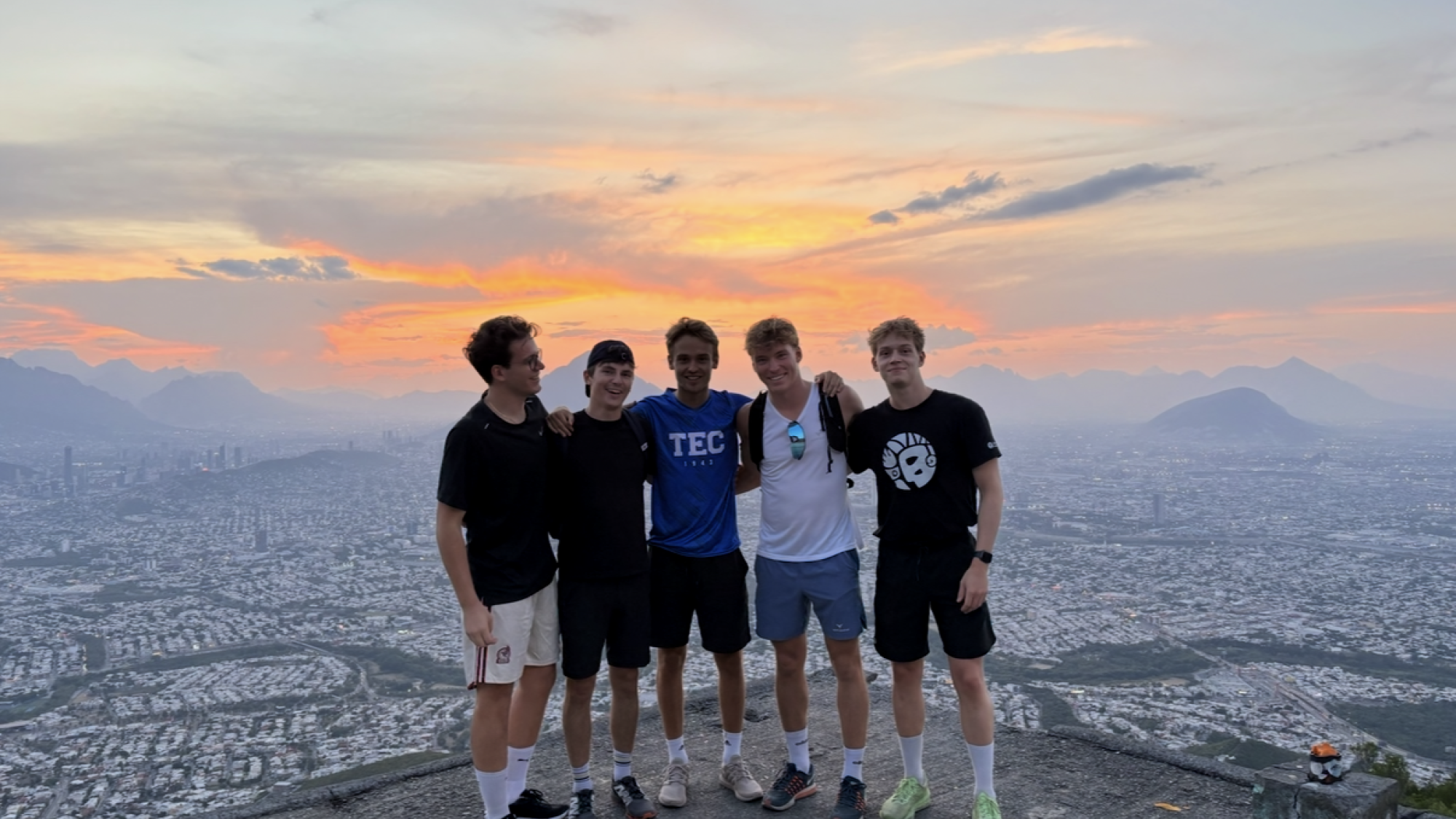 A group of exchange students enjoying the view of a city