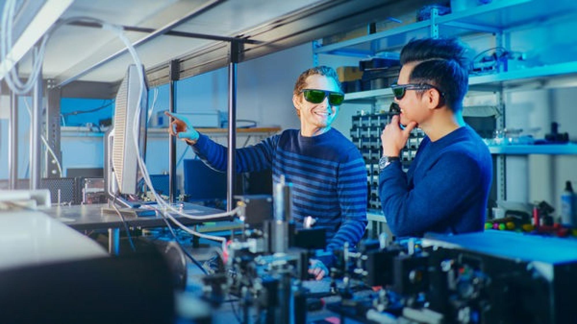 Student and a teacher in a laboratory.