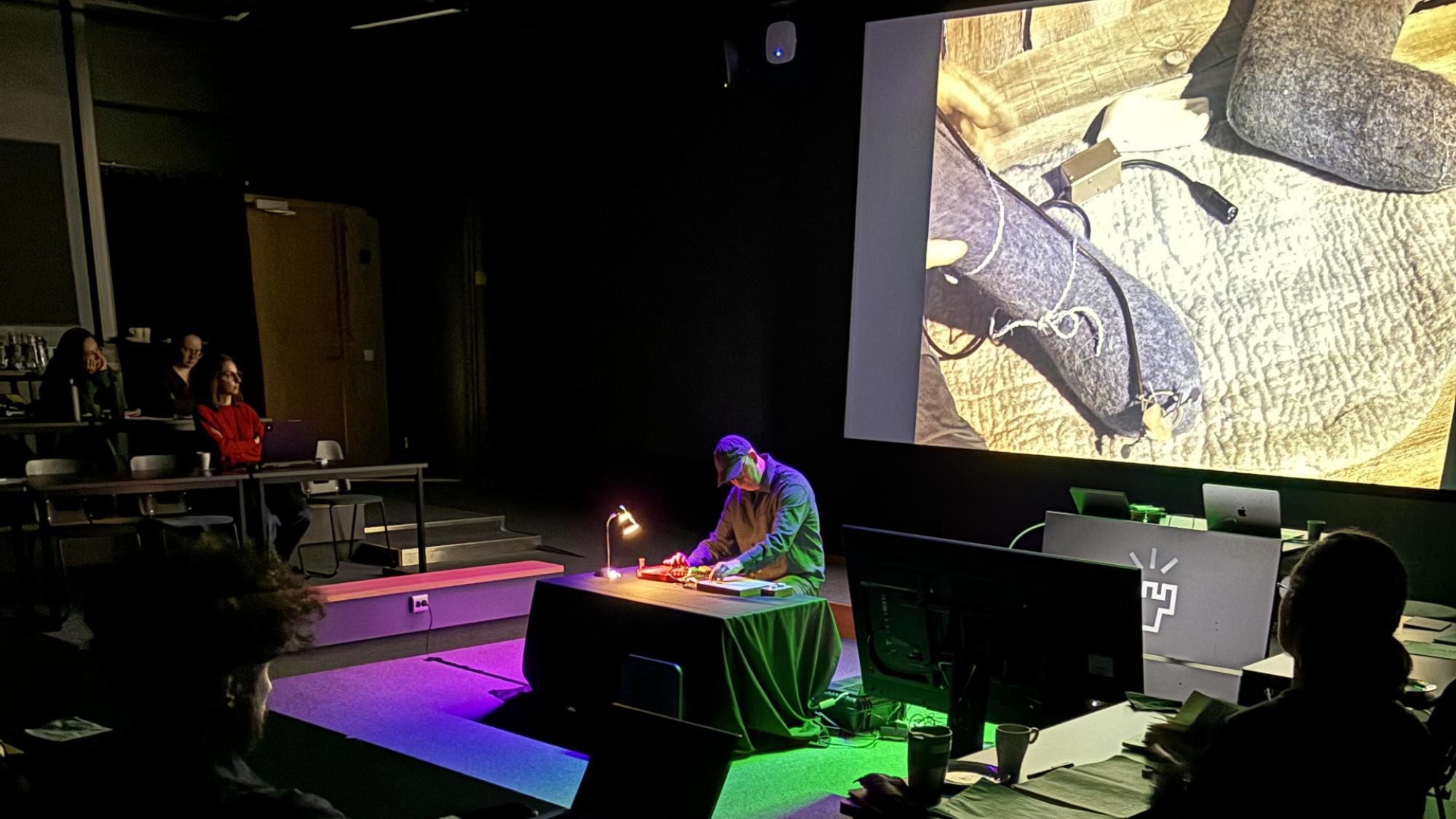 A photo of Espen Sommer Eide performing a live performance of his work Wild Music Reserve (Pasvik) during the event