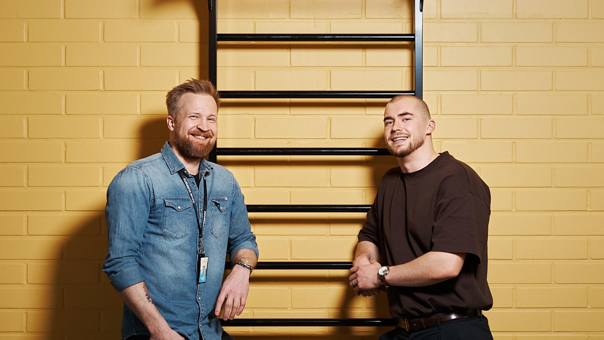 Tero Huhtala and Toni Keränen, yellow brick wall on the background.