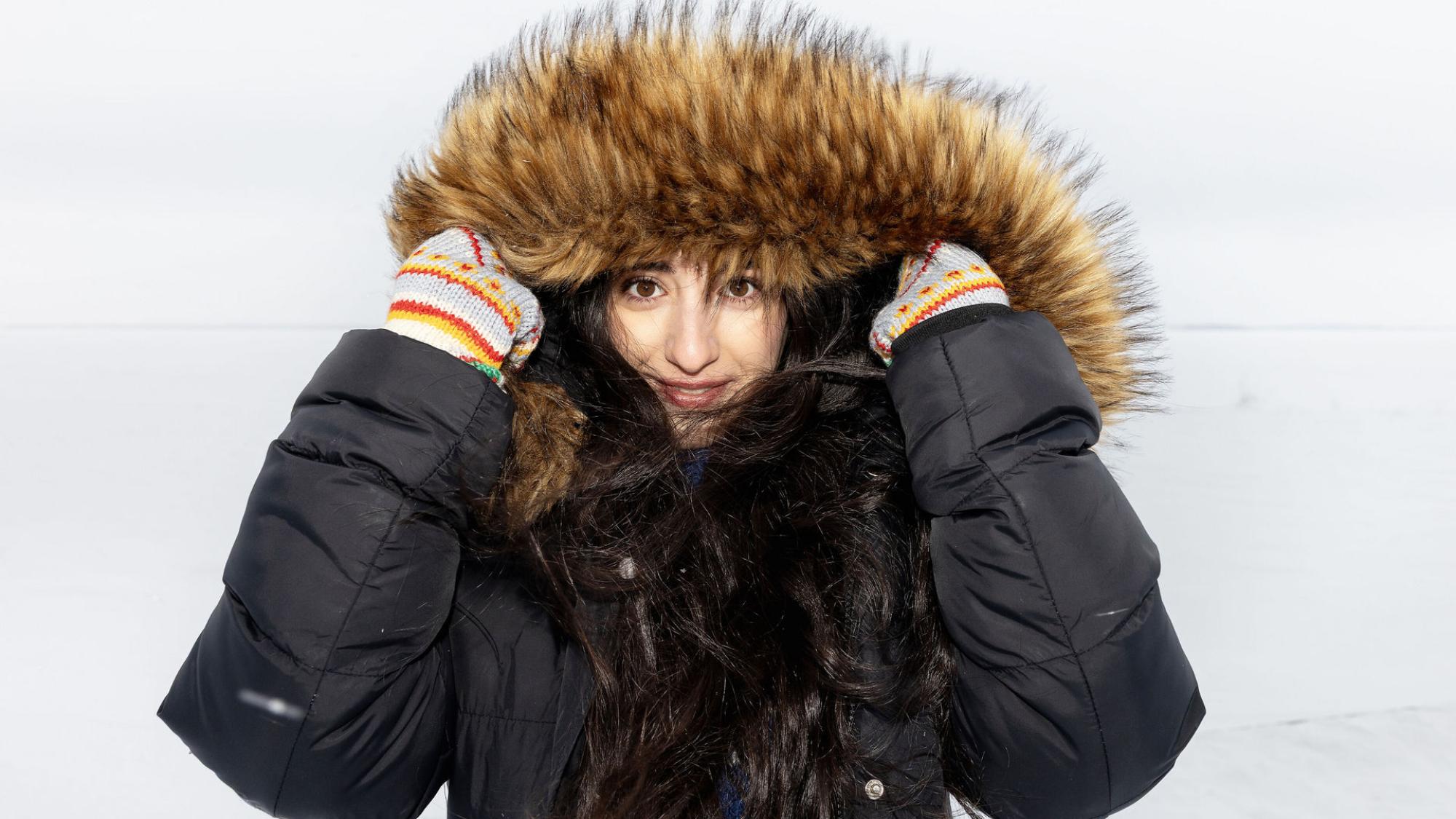 A woman in winter with a warm jacket.