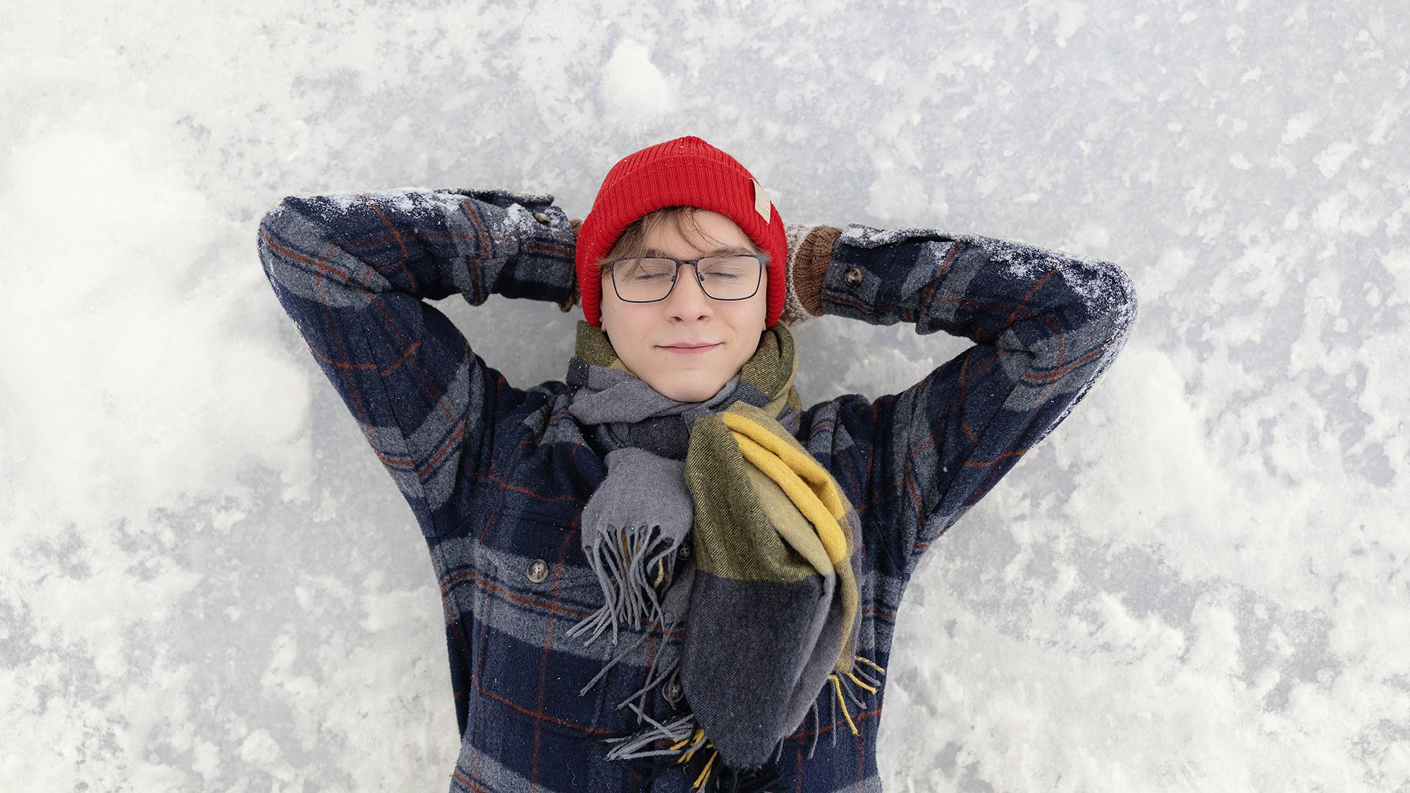 a young man lying on the ice